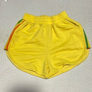 Yellow kids shorts with rainbow sides size 140